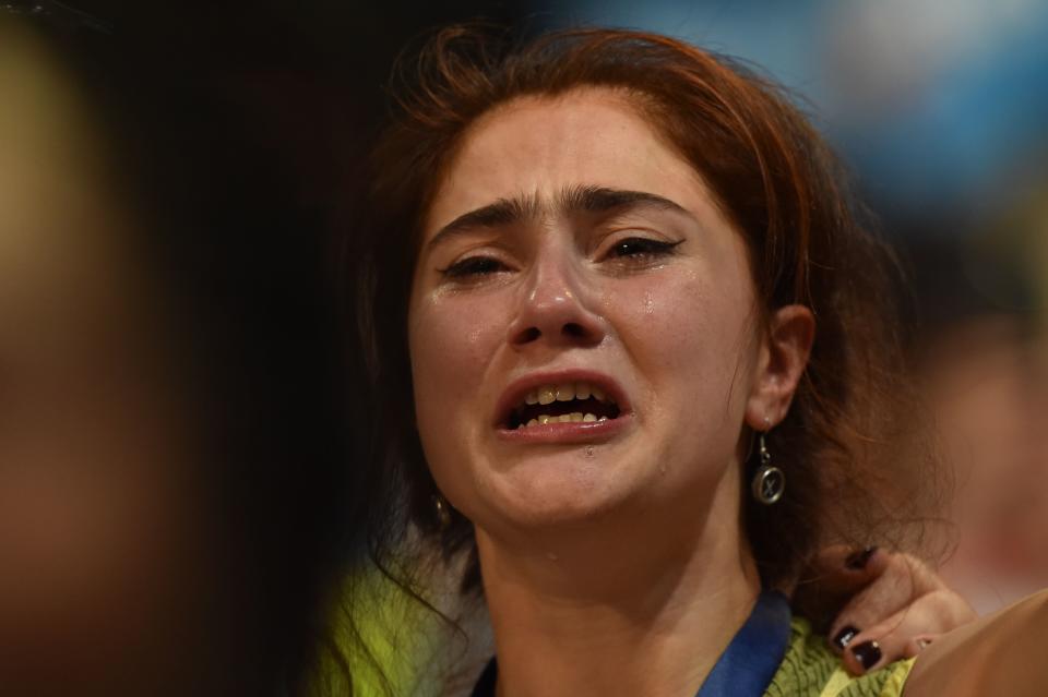 A supporter of Vermont Senator Bernie Sanders cries as the former Democratic presidential candidate addresses the Democratic National Convention.