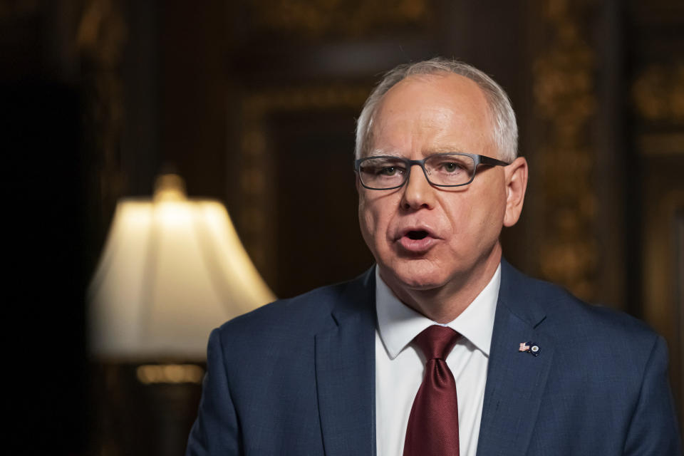 FILE - Minnesota Gov. Tim Walz speaks from the Governor's Reception room at the State Capitol, to discuss the latest steps in his response to COVID-19, Wednesday, Nov. 18, 2020, in St. Paul, Minn. Faulting inaction in Washington, governors and state lawmakers are racing to get needed pandemic relief to small businesses, the unemployed, renters and others affected by the widening coronavirus outbreak. (Glen Stubbe/Star Tribune via AP, Pool, File)