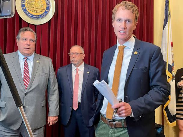 PHOTO: West Virginia Senate minority leader Stephen Baldwin, right, speaks during a news conference prior to the start of a Senate session, on July 29, 2022, in Charleston, W.Va. Behind him are fellow Democratic Sens. Mike Romano left, and Mike Caputo. (John Raby/AP)