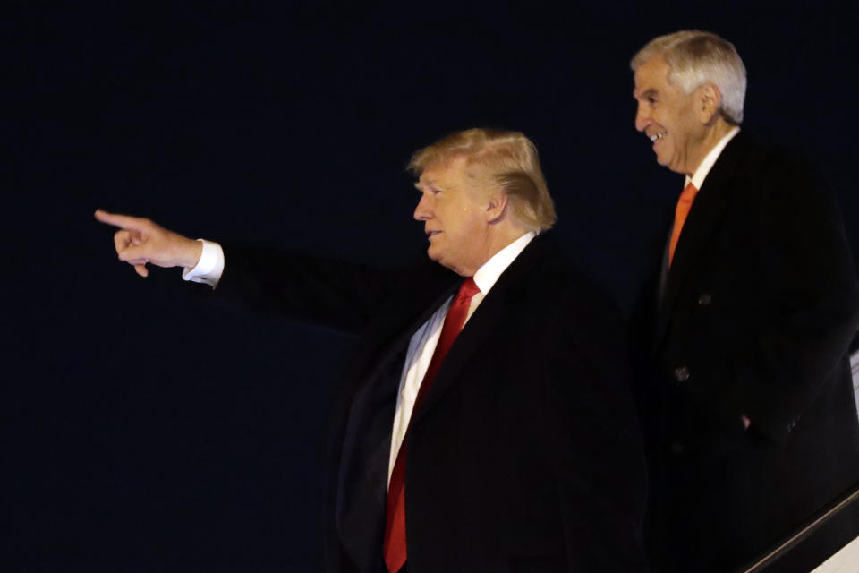 President Donald Trump arrives at Barksdale Air Force Base for a campaign rally in Bossier City, La., Thursday, Nov. 14, 2019, in Barksdale Air Force Base, La., with Louisiana Republican gubernatorial candidate Eddie Rispone. (AP Photo/ Evan Vucci)