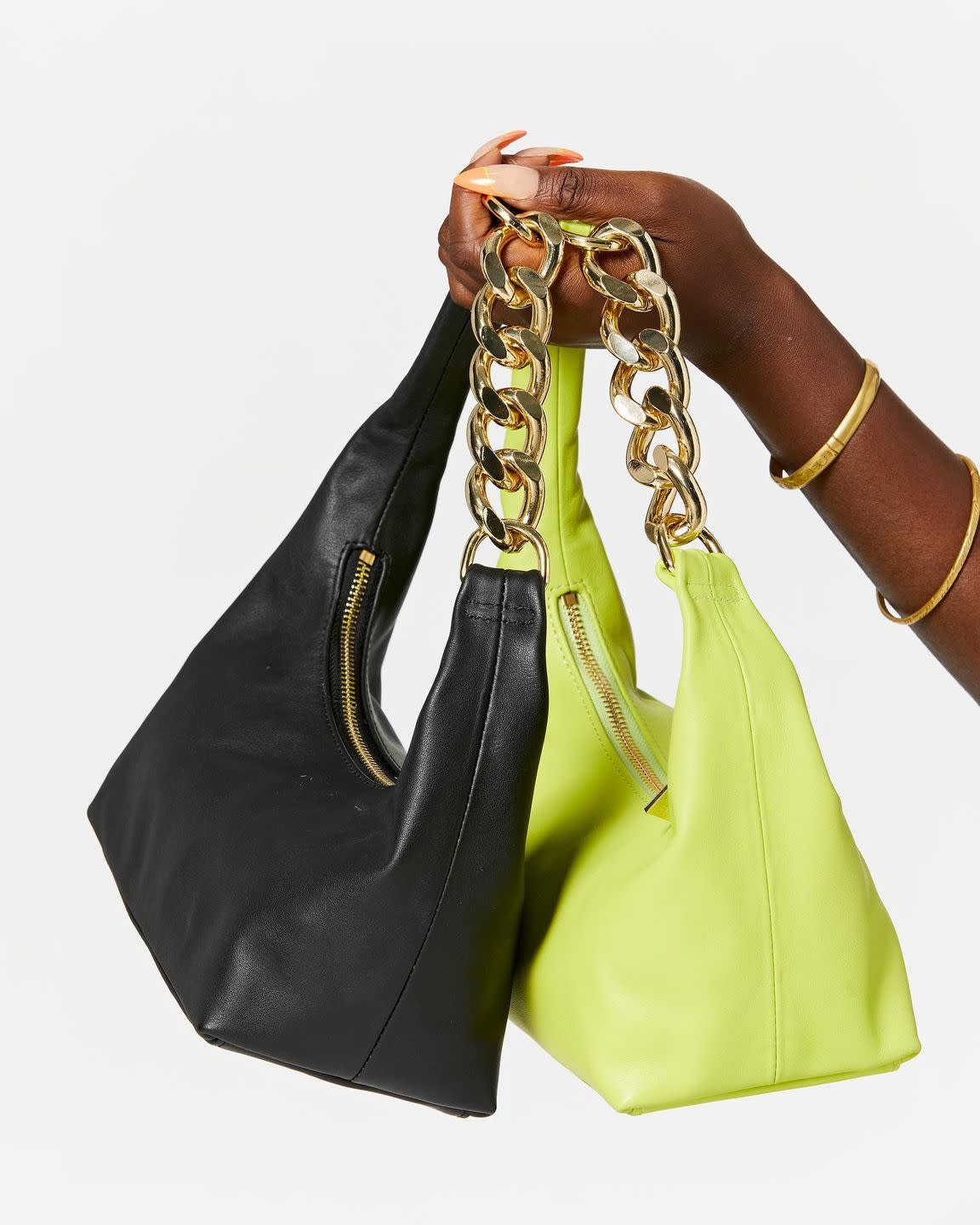 one black bag and one neon yellow leather bag side by side