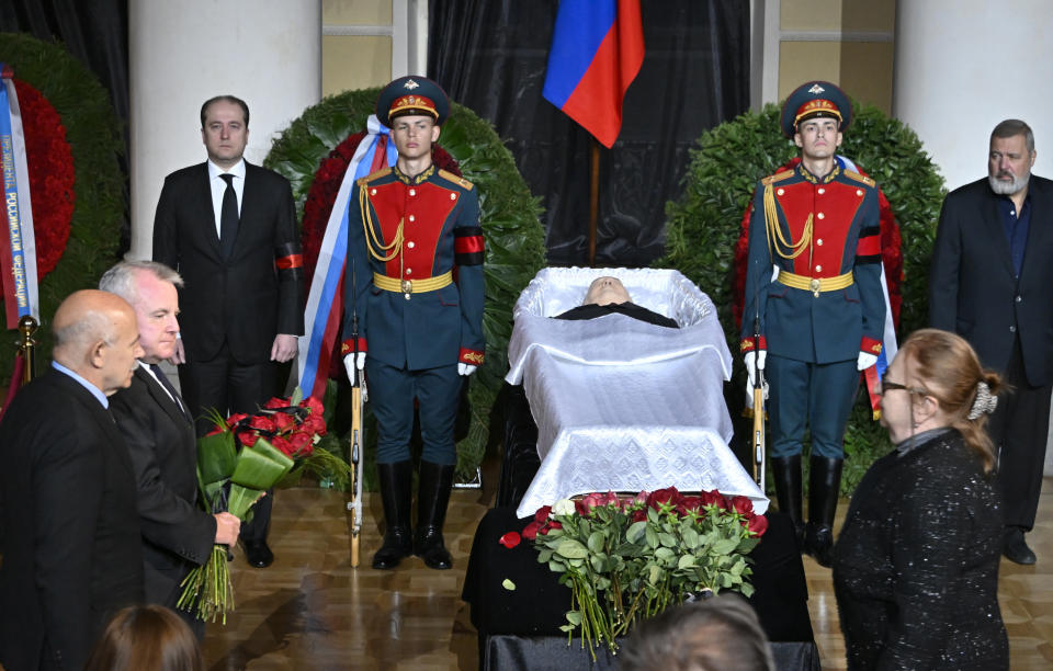 US ambassador to Russia John Joseph Sullivan, second left, walks to the coffin of former Soviet President Mikhail Gorbachev inside the Pillar Hall of the House of the Unions during a farewell ceremony in Moscow, Russia, Saturday, Sept. 3, 2022. Gorbachev, who died Tuesday at the age of 91, will be buried at Moscow's Novodevichy cemetery next to his wife, Raisa, following a farewell ceremony at the Pillar Hall of the House of the Unions, an iconic mansion near the Kremlin that has served as the venue for state funerals since Soviet times. (Alexander Nemenov/Pool Photo via AP)