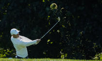 Rory McIlroy, of Northern Ireland, hits out of the rough on the 14th hole during the third round of the US Open Golf Championship, Saturday, Sept. 19, 2020, in Mamaroneck, N.Y. (AP Photo/Charles Krupa)