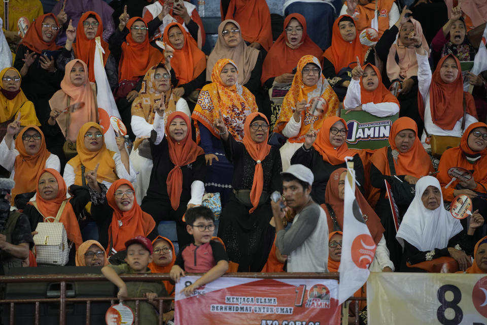 Supporters cheer during the campaign rally of presidential candidate Anies Baswedan at a stadium in Jakarta, Indonesia, Tuesday, Nov. 28, 2023. Candidates officially began their campaign for next year's election which will determine who will succeed President Joko Widodo who is now serving his second and final term. (AP Photo/Achmad Ibrahim)