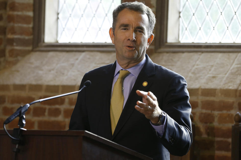 Virginia Gov. Ralph Northam addresses a commemorative meeting of the Virginia General Assembly on the 400th anniversary of the first House of Burgess meeting at a church in Historic Jamestown, Va., on the site where the meeting took place, Tuesday, July 30, 2019. President Donald Trump is scheduled to speak later at a second ceremony to mark the historic meeting, which was the first representative assembly in the colony. (AP Photo/Steve Helber)