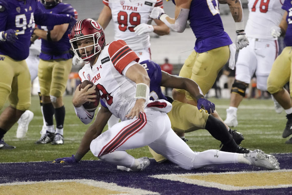 Utah quarterback Jake Bentley keeps the ball for a touchdown against Washington during the first half of an NCAA college football game Saturday, Nov. 28, 2020, in Seattle. (AP Photo/Ted S. Warren)