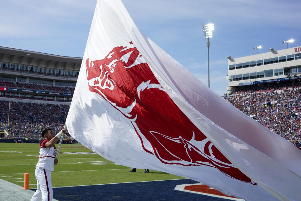 Oct 9, 2021; Oxford, Mississippi, USA; Arkansas Razorbacks cheerleader flies their flag after a score against Mississippi Rebels at Vaught-Hemingway Stadium. Mandatory Credit: Marvin Gentry-USA TODAY Sports