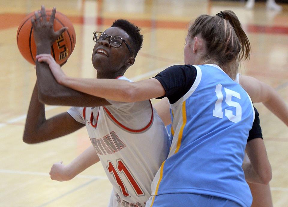 Kai Burnett of Smyrna trying to put the ball up closely guarded by Amalia Fruchman of Cape Henlopen.
