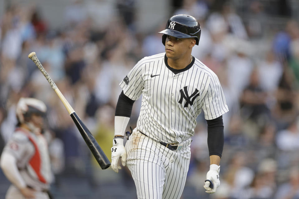 New York Yankees' Juan Soto throws his bat after hitting a two-run home run against the Houston Astros during the first inning of a baseball game Wednesday, May 8, 2024, in New York. (AP Photo/Adam Hunger)