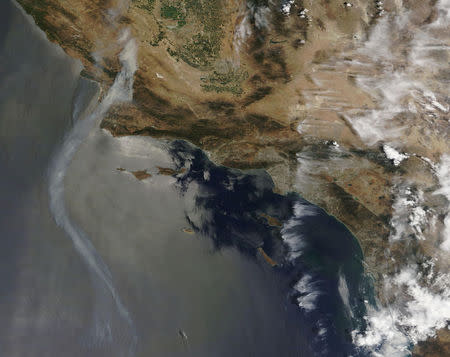 Smoke rises from fires in California in this July 8, 2017 handout satellite image. NASA/Handout via REUTERS