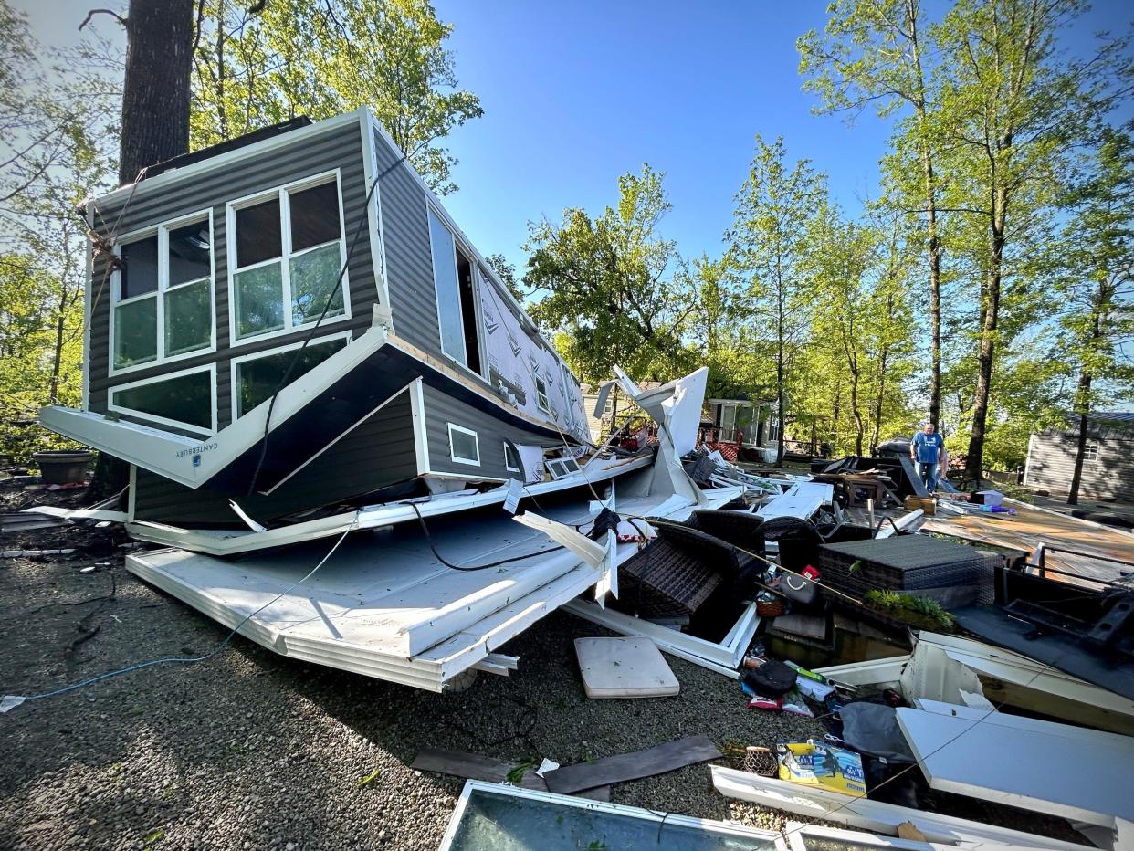 Dale Tackett’s park camper was rolled over in the high winds at the Hickory Woods Campground Tuesday. Tackett, of Tipp City, Ohio, was not at the structure, but he came Wednesday to assess the damage and begin cleaning up.