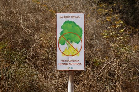 A sign warning against setting fires is seen at the Kirindy forest inside the Menabe Antimena protected area near the city of Morondava