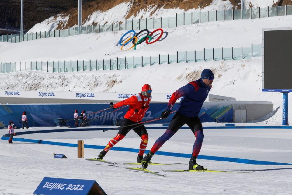 An athlete and his coach train at the National Biathlon Centre, ahead of the Winter Olympics (Reuters)