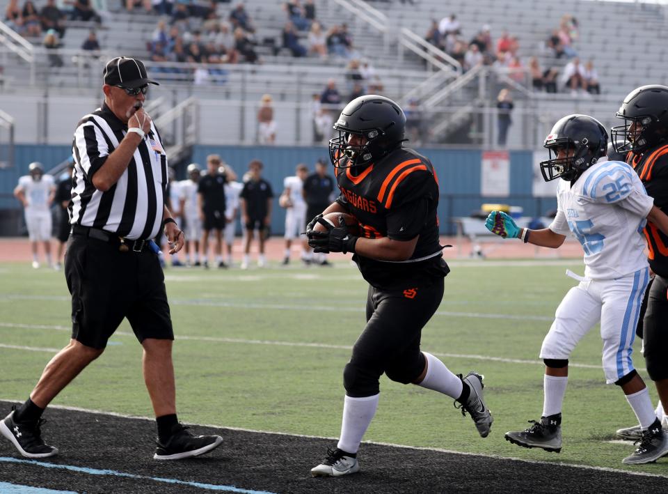 Jose Perez scores the first touchdown in Del Sol High School's history during a freshman game against Buena on Aug. 17.