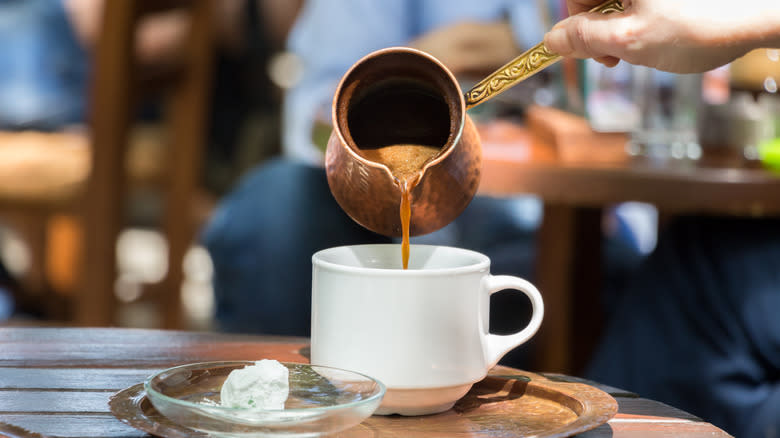 Greek coffee pored into cup