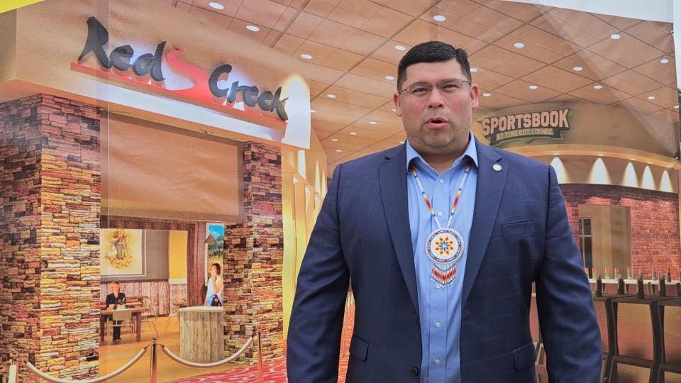 Mississippi Band of Choctaw Indians Tribal Chief Cyrus Ben explains the excitement the tribe has on the Bok Homa Casino's plan to expand. He is standing in front of computer-generated images of what the new additions will look like when construction is complete. The casino held a news conference Thursday, March 9, 2023, to announce the planned expansion at the casino, located near Sandersville, Miss.