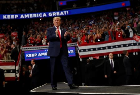 U.S. President Donald Trump reacts on stage formally kicking off his re-election bid with a campaign rally in Orlando