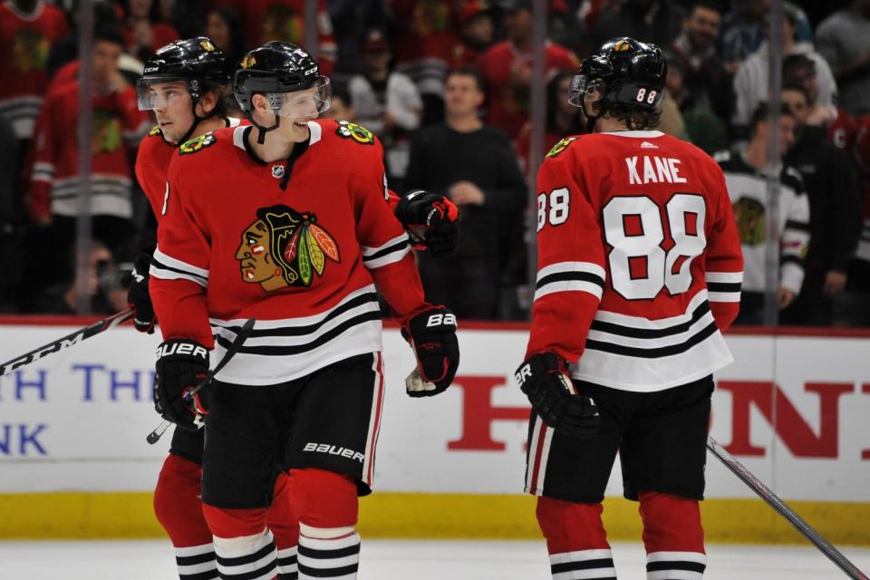 Chicago Blackhawks' Dominik Kubalik celebrates with teammate Patrick Kane after defeating the San Jose Sharks.