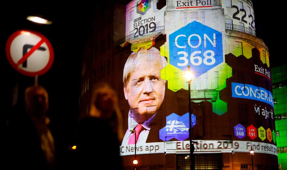 The BBC's exit poll results are seen projected on the outside of a BBC building in London, on Dec. 12, 2019.