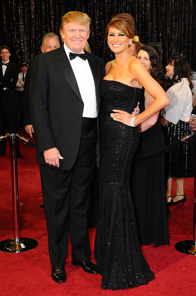 <p>In 2011, Melania wore a simple black strapless gown and a chic side-parted updo to the 83rd Academy Awards. (Photo: Getty Images) </p>