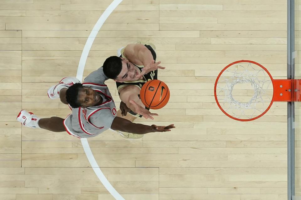 Jan 5, 2023; Columbus, OH, USA;  Ohio State Buckeyes center Felix Okpara (34) and Purdue Boilermakers center Zach Edey (15) reach for a rebound during the first half of the NCAA men's basketball game at Value City Arena. Purdue won 71-69. Mandatory Credit: Adam Cairns-The Columbus Dispatch