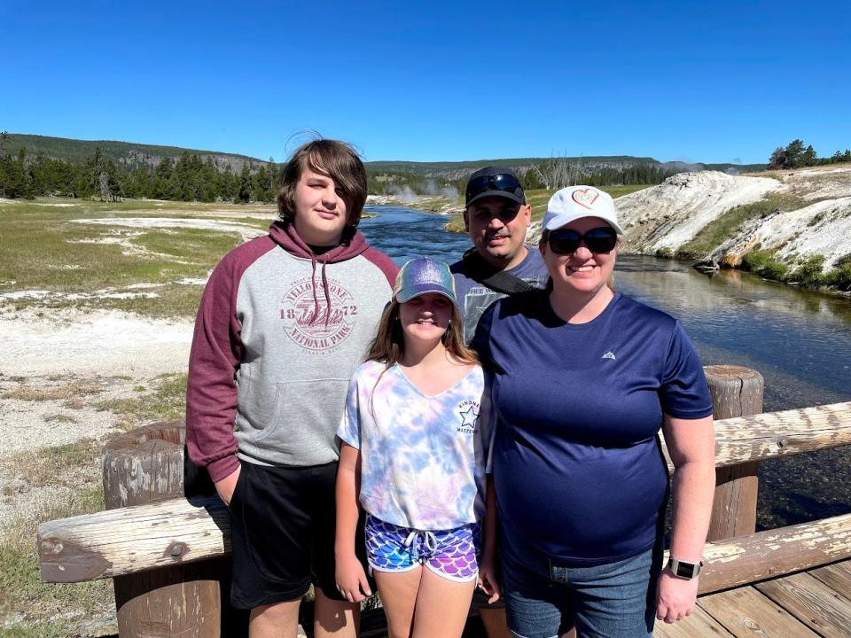 The Gawel family (from left): Alex, Bekah, Steve and Laura, pose at a Prismatic pool at Yellowstone National Park. The family visited the park with the Every Kid Outdoors Pass.
Provided