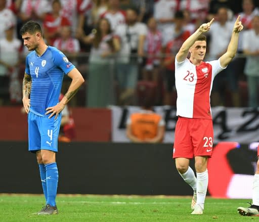 Krzysztof Piatek (R) set Poland on their way to a 4-0 win over Israel that leaves them with maximum points