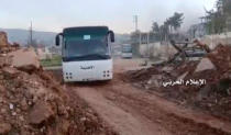 A still image taken from a video uploaded by the Syrian Army on April 19, 2017, shows buses carrying rebel fighters and their families leaving the the town of Zabadani, near Damascus, Syria. Syrian Army/Handout via Reuters TV