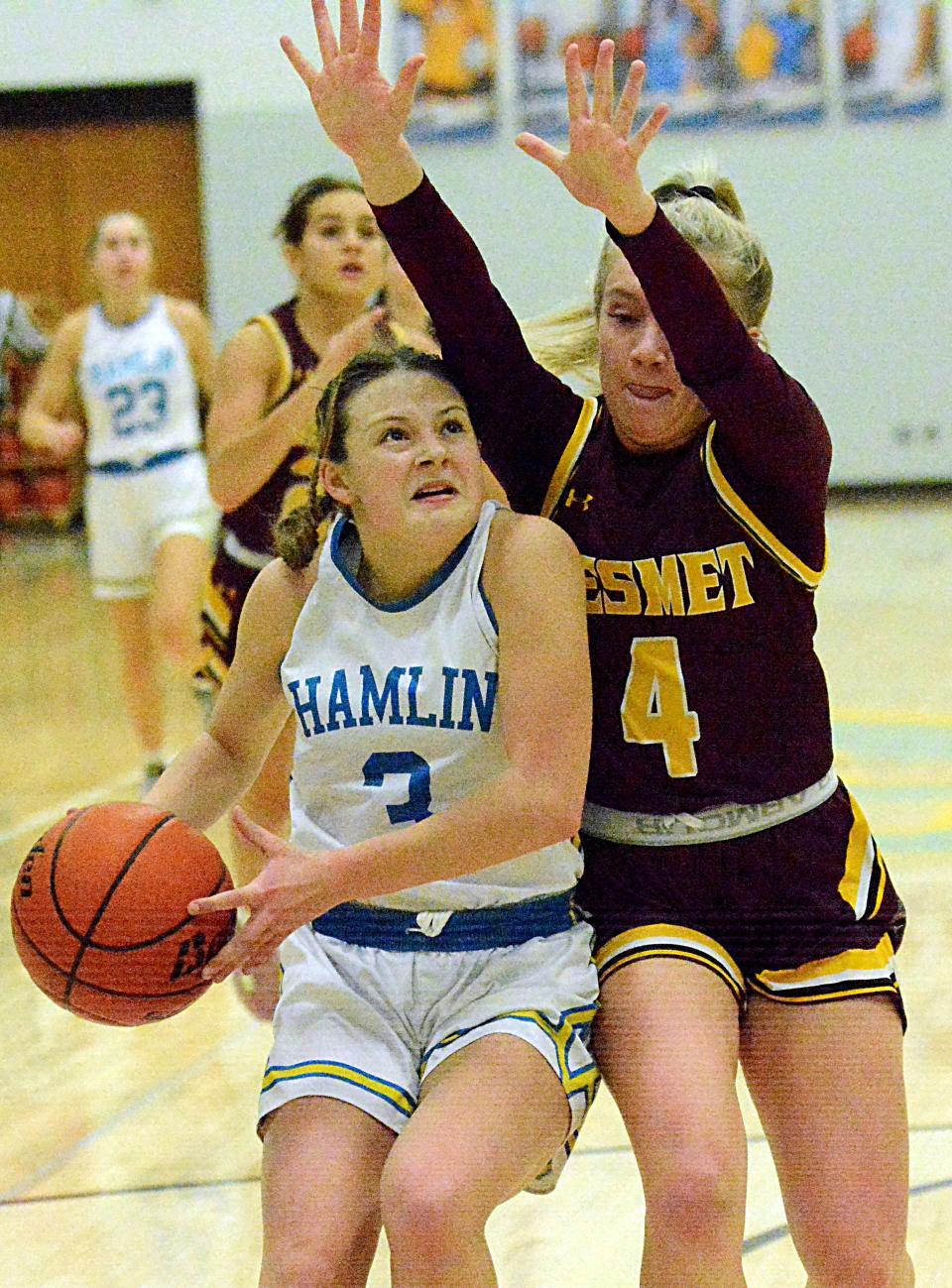 Hamlin's Addie Neuendorf drives against De Smet's Alyssa Asleson during a Lake Central Conference high school basketball doubleheader on Tuesday, Jan. 17, 2023 at the Hamlin Education Center.