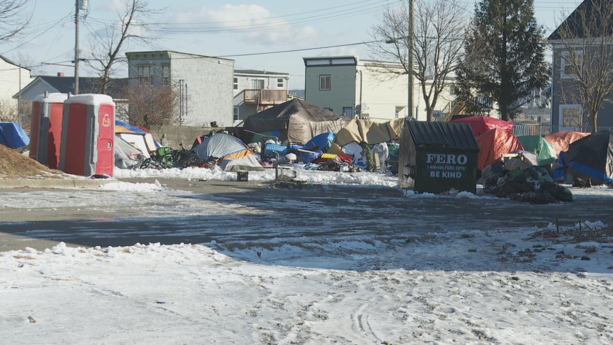 Portable toilets and a dumpster are provided at this encampment between Waterloo and Exmouth streets in Saint John.  (Graham Thompson/CBC - image credit)