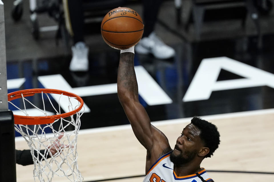 Phoenix Suns center Deandre Ayton (22) scores in the first half of an NBA basketball game against the Atlanta Hawks Wednesday, May 5, 2021, in Atlanta. (AP Photo/John Bazemore)