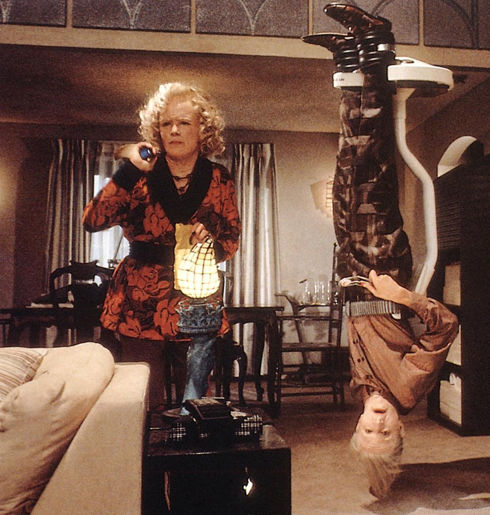 Lea Thompson and Jeffrey Weissman in a scene, Jeffrey suspended upside down