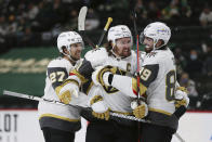 Vegas Golden Knights' Mark Stone (61) celebrates with teammates after scoring a goal against the Minnesota Wild during the second period in Game 3 of a first-round NHL hockey playoff series Thursday, May 20, 2021, in St. Paul, Minn. (AP Photo/Stacy Bengs)