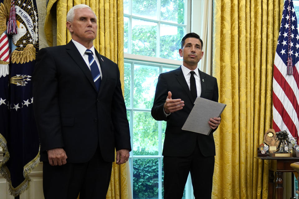 Vice President Mike Pence listens as acting Secretary of Homeland Security Chad Wolf speaks during a briefing on the 2020 hurricane season in the Oval Office of the White House, Thursday, May 28, 2020, in Washington. (AP Photo/Evan Vucci)