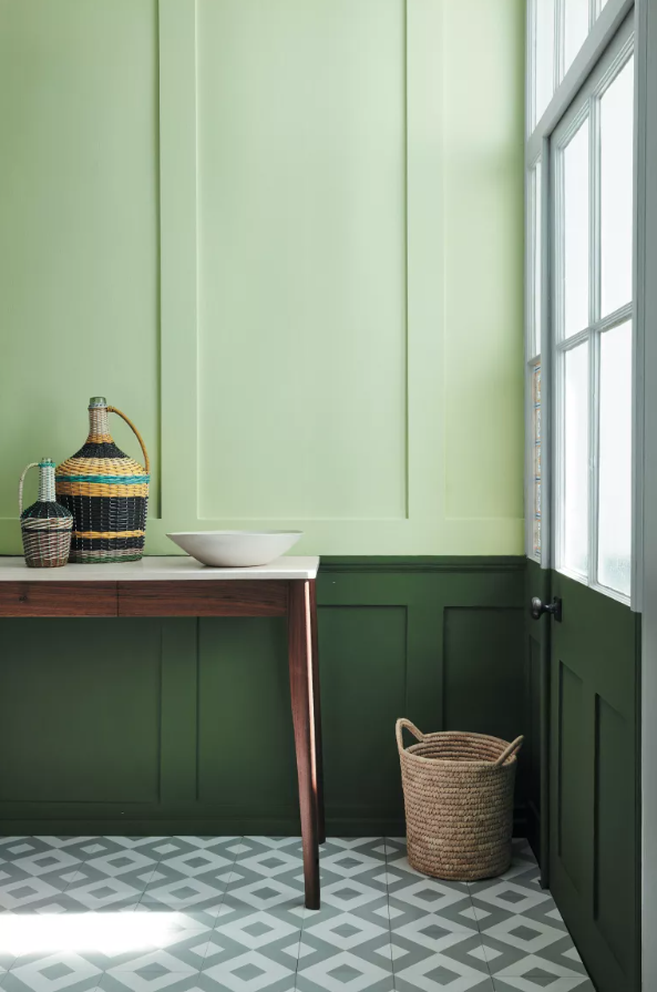 <p> Using two shades of one color can add subtle interest to a hallway, but keep the look restful. Go for green, as in this space, to maximize the calmness of the atmosphere.  </p> <p> The top part of this wall features Acorn from Little Greene, while Hopper below the dado rail adds depth and is what your eye sees first.  </p> <p> The tiles act as the perfect foil to the flat wall color and create a lighter feel.  </p>