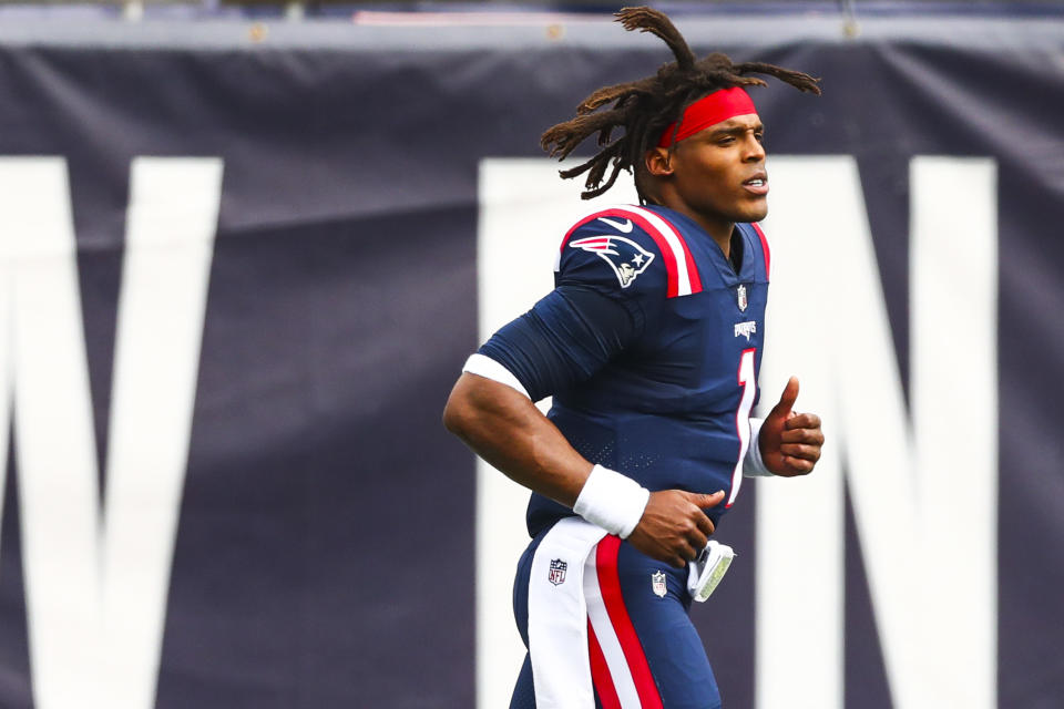 FOXBOROUGH, MASSACHUSETTS - SEPTEMBER 27: Cam Newton #1 of the New England Patriots runs onto the field before a game against the Las Vegas Raiders at Gillette Stadium on September 27, 2020 in Foxborough, Massachusetts. (Photo by Adam Glanzman/Getty Images)