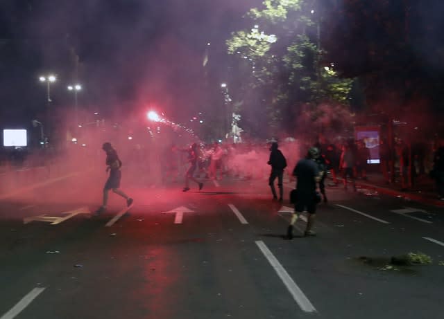 Hundreds of demonstrators tried to storm Serbia’s parliament on Friday