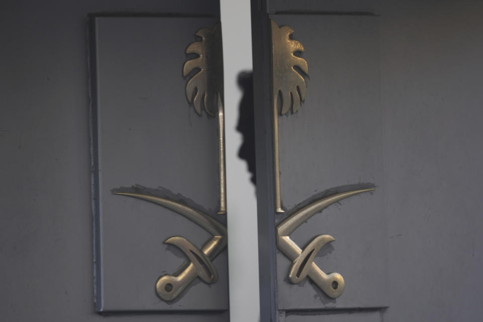 FILE - In this Oct. 16, 2018, file photo, a security personnel is seen inside the entrance of the Saudi Arabia's Consulate in Istanbul. One mystery surrounding the killing of Saudi journalist Jamal Khashoggi in the Saudi Consulate is the purported existence of audio recordings of his death. The reports add to tales of intrigue and surveillance in Turkey, a country where wiretapping scandals have erupted before and whose government closely monitors the internet, banning websites and targeting critics deemed to be a threat to national security. (AP Photo/Petros Giannakouris, File)