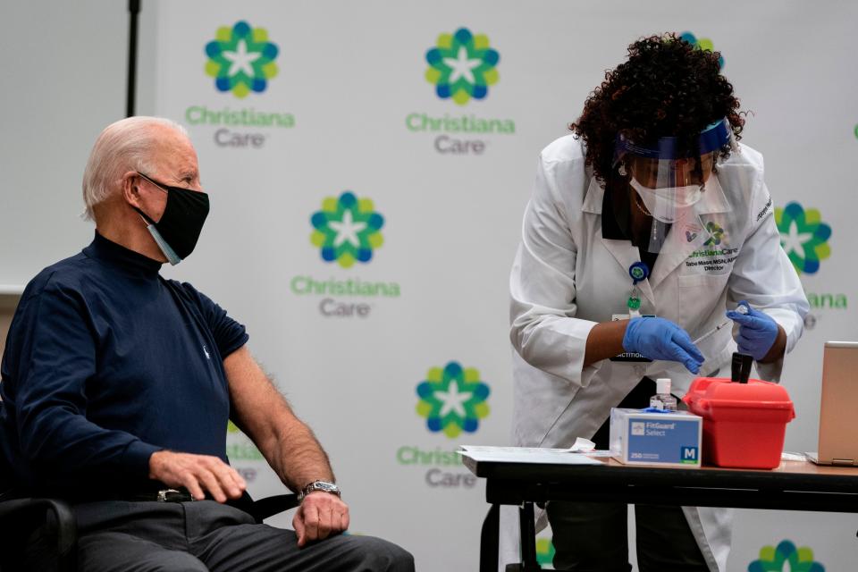 Tabe Mase, nurse practitioner and head of employee health services at ChristianaCare, fills a syringe as President-elect Joe Biden receives a COVID-19 vaccination at the ChristianaCare campus in Stanton on December 21, 2020.