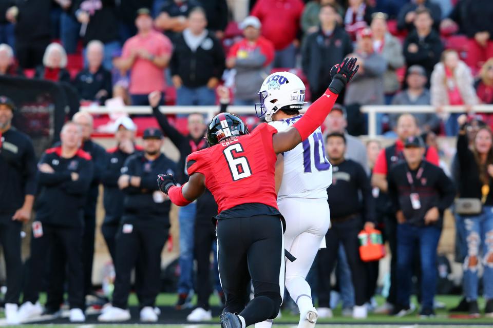 Nov 2, 2023; Lubbock, Texas, USA; Texas Tech Red Raiders defensive end Myles Cole (6) pressures Texas Christian Horned Frogs quarterback Josh Hoover (10) in the first half at Jones AT&T Stadium and Cody Campbell Field. Mandatory Credit: Michael C. Johnson-USA TODAY Sports