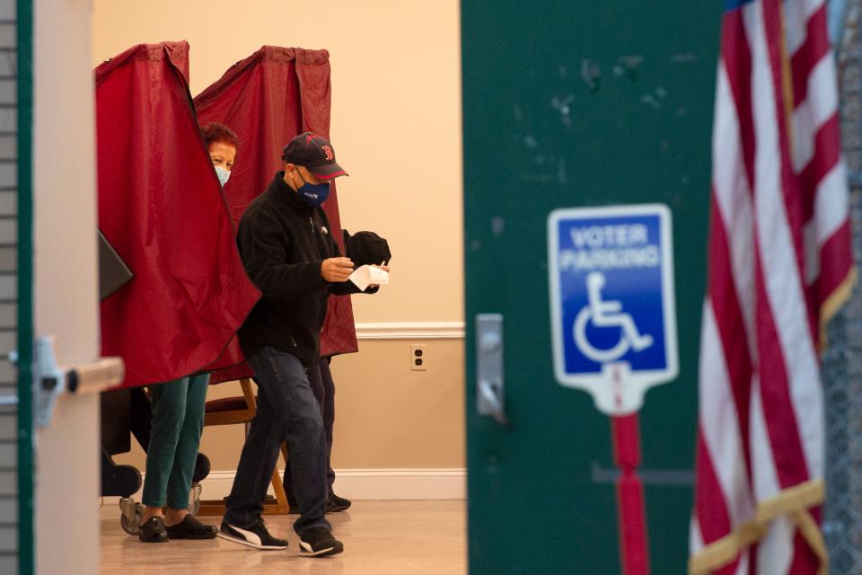 A voter exits the voting booth at the Hackensack Civic Center on State St in Hackensack, N.J. on Tuesday Nov. 2, 2021. 