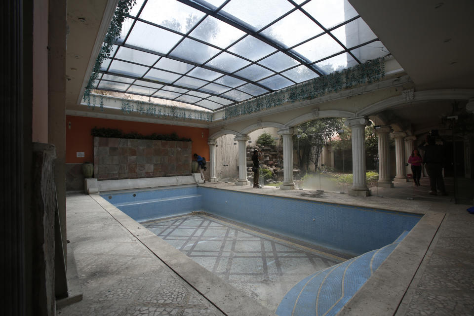 CORRECTS DAY OF WEEK - The mansion of Chinese-Mexican businessman Zhenli Ye Gon during a media tour in Mexico City, Tuesday, July 30, 2019. The federal government said Monday it will hold an Aug. 11 auction for the Mexico City mansion worth $5 million (95 million Mexican pesos) that previously belonged to the suspected drug trafficker. (AP Photo/Ginnette Riquelme)