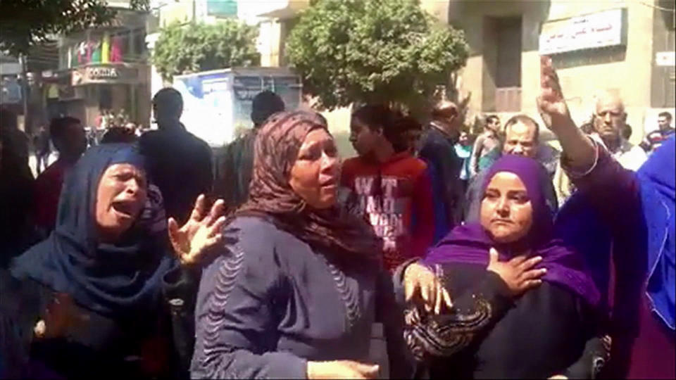 This image made from video shows relatives reacting after an Egyptian court on Monday sentenced to death 529 supporters of ousted Islamist President Mohammed Morsi in connection to an attack on a police station that killed a senior police officer in Minya, Egypt, Monday, March 24, 2014. The convictions came after after two sessions in a mass trial that raised an outcry from rights activists and threatened to spark a violent backlash.(AP Photo via AP video)