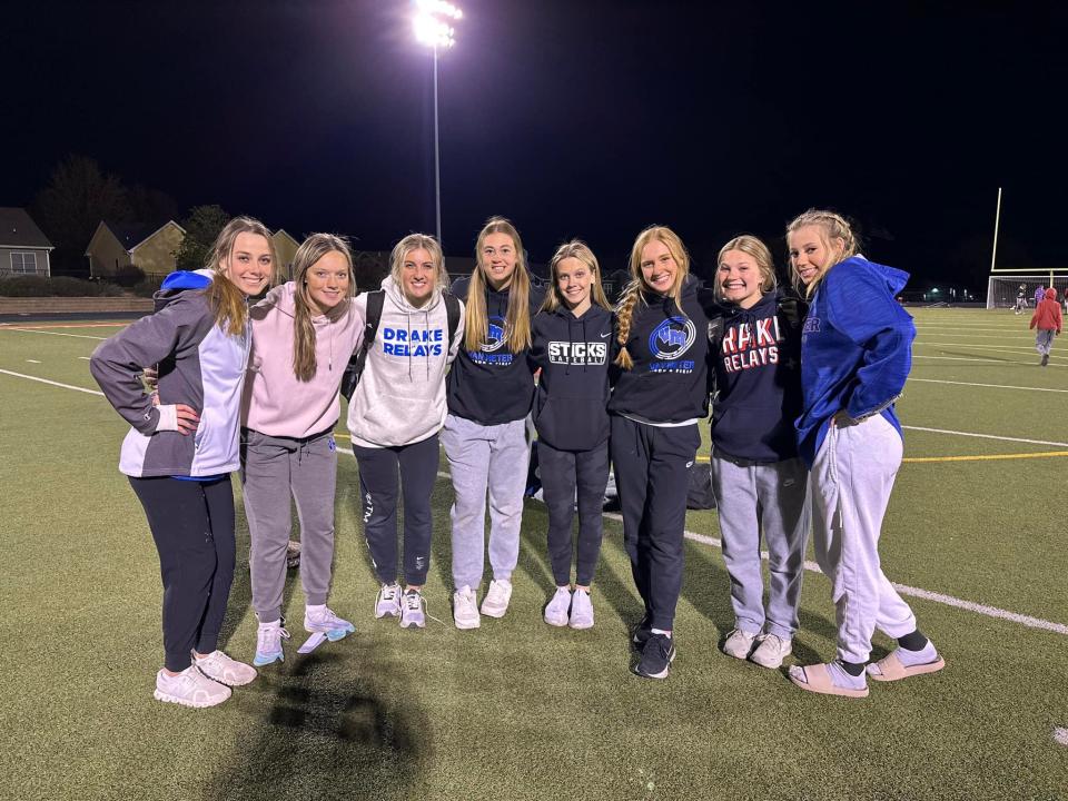 Members of the Van Meter girls track and field team pose for a photo after winning the West Central Activities Conference meet on Tuesday, May 2, 2023, in Earlham.