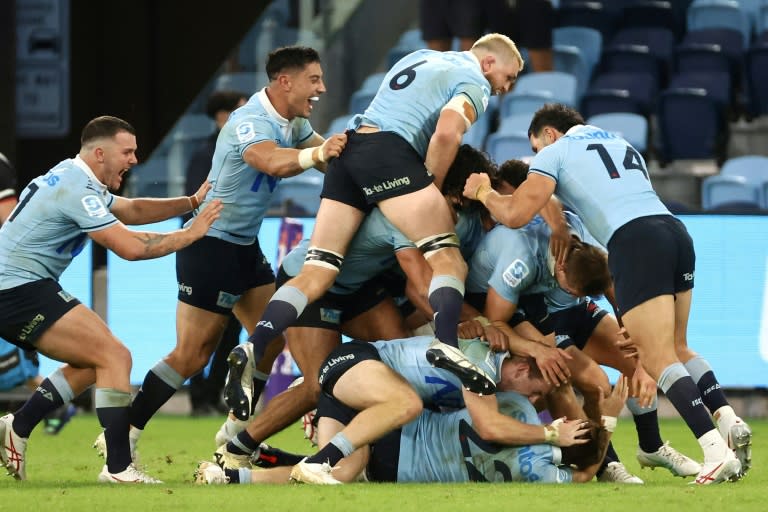 Waratahs’ players celebrate teammate the Crusaders in Sydney (DAVID GRAY)