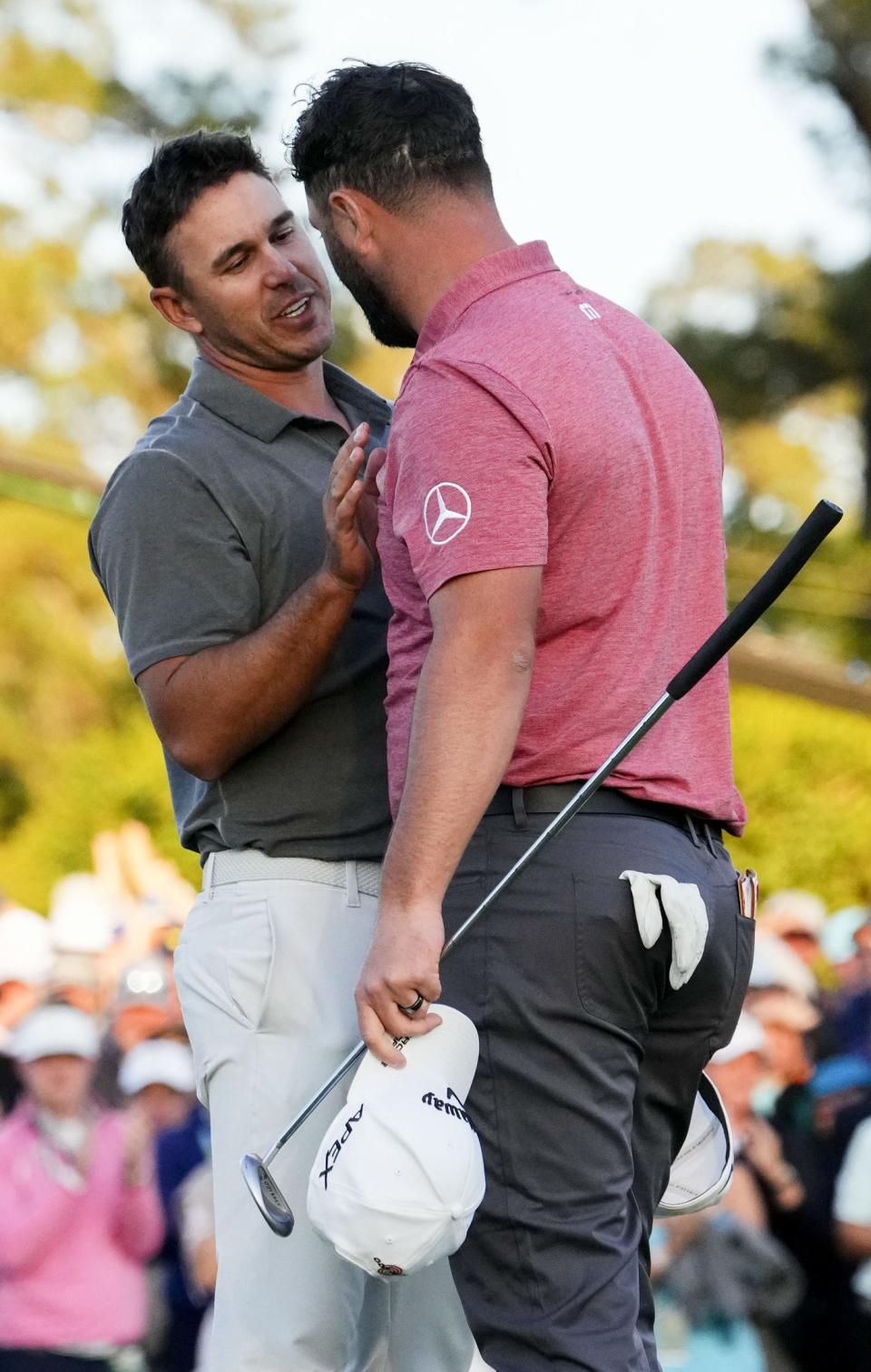 Apr 9, 2023; Augusta, Georgia, USA; Brooks Koepka congratulates Jon Rahm on the 18th green during the final round of The Masters golf tournament. Mandatory Credit: Rob Schumacher-USA TODAY Network