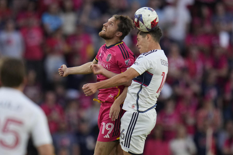 St. Louis City's Indiana Vassilev (19) and Vancouver Whitecaps' Sebastian Berhalter (16) reach for the ball during the first half of an MLS soccer match Saturday, May 27, 2023, in St. Louis. (AP Photo/Jeff Roberson)