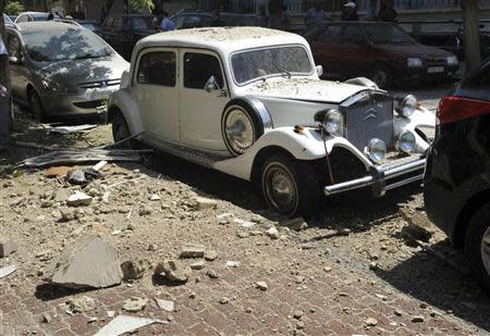 Rubble is seen after a rocket hit a building at the upscale al-Maliki neighborhood in Damascus September 2, 2013, in this handout photo released by Syria's national news agency SANA. REUTERS/SANA/Handout via Reuters