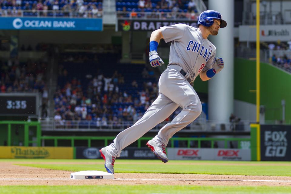 Chicago Cubs' leadoff man Ian Happ rounds the bases after hitting a first-pitch home run in the season opener. (AP)