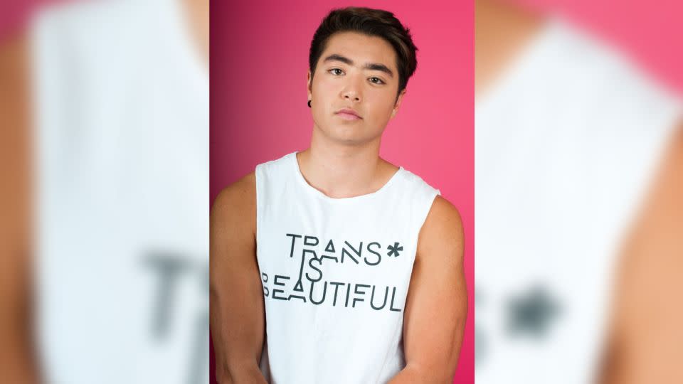 Transgender athlete and advocate Schuyler Bailar of New York City wears a tank that says "trans is beautiful" in 2017. - Amos Mac